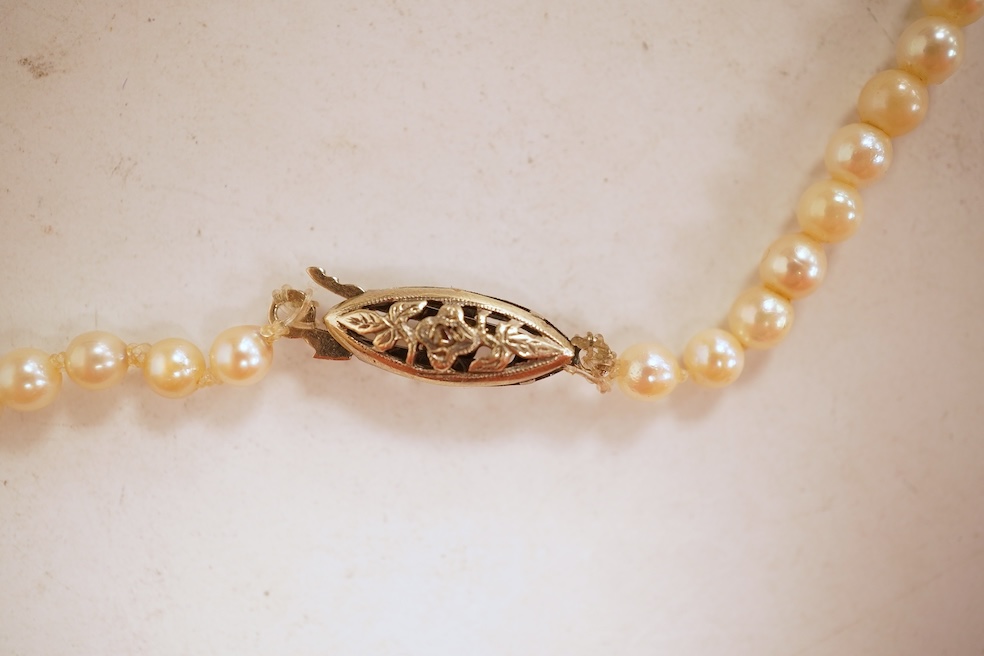 An eight-strand seed pearl choker necklace, with a rose-cut diamond clasp, length 34cm, pearls untested; together with a single strand graduated cultured pearl necklace, length 40cm, clasp stamped 9ct, Condition: good, s